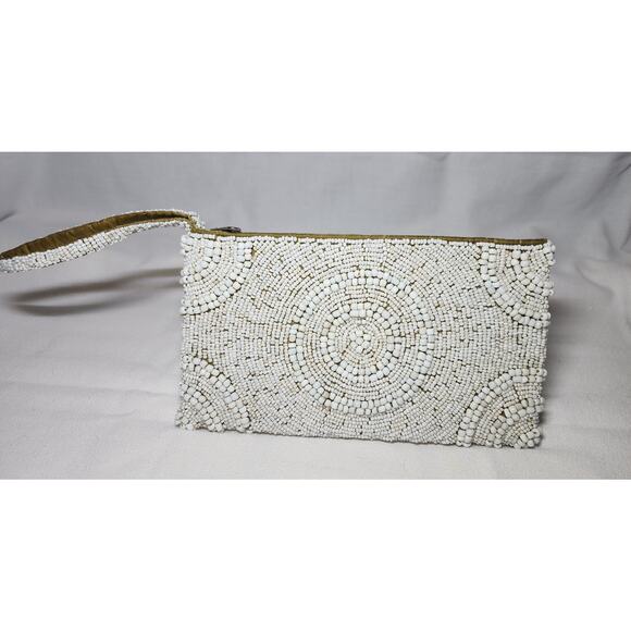 Tommy Bahama Handbags - Tommy Bahama Ivory Beaded Zippered Wristlet